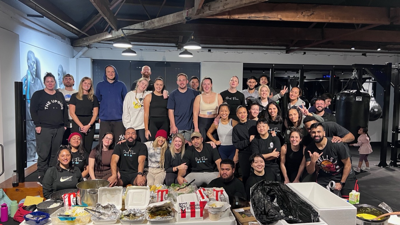 Pad Flow members posing together after a community meal
