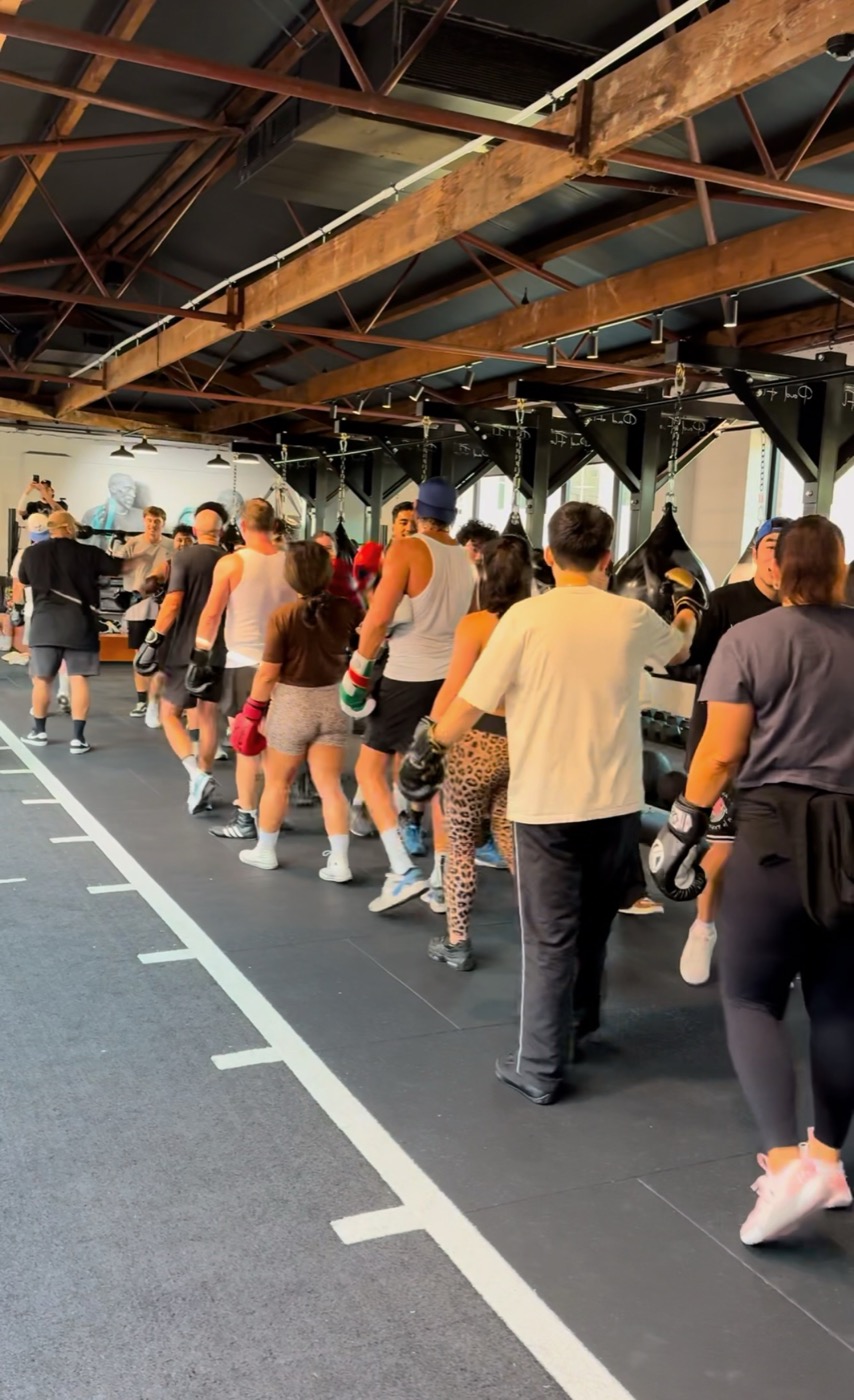 Pad Flow members training together in a busy class