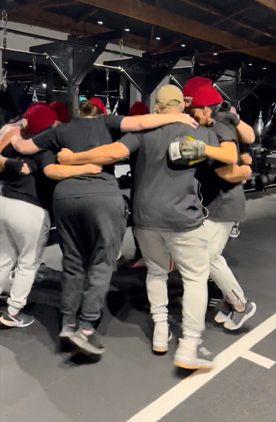 Pad Flow members in a huddle at the gym