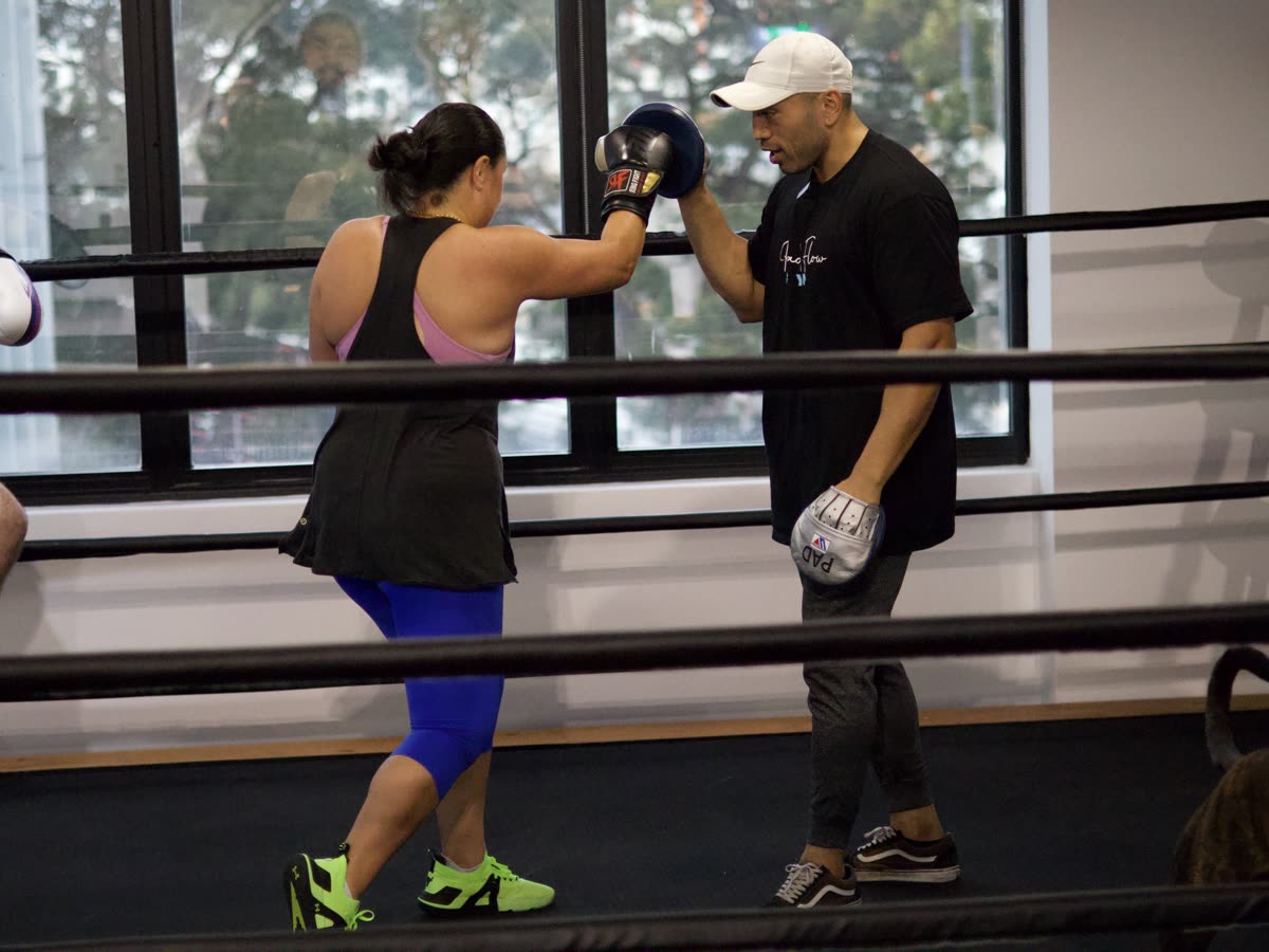 Beginner learning the fundamentals one on one with a Pad Flow coach